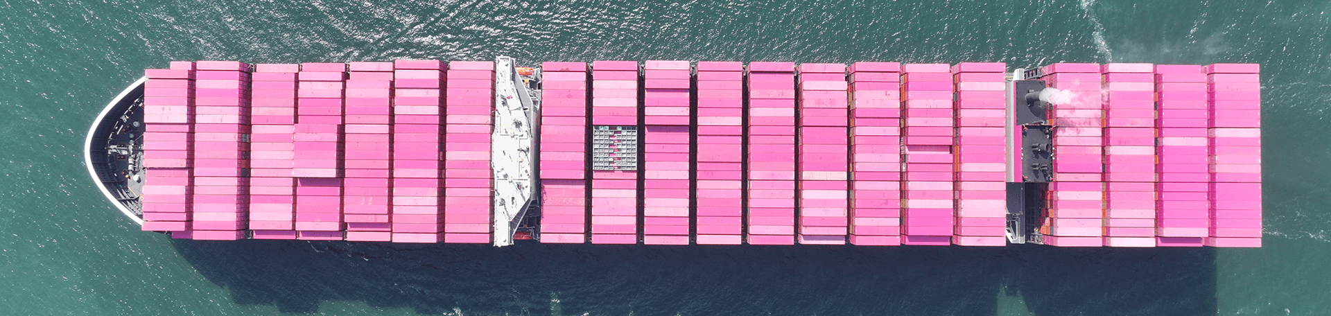 Aerial view of ONE container ship loaded with containers sailing across the ocean