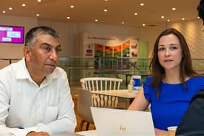 Colleague discussion on cybersecurity initiatives